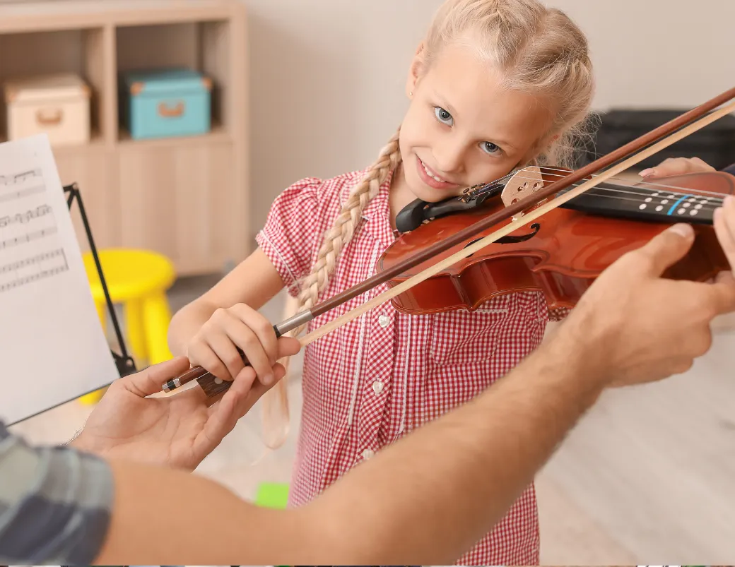 A photo of a musician receiving guidance from a teacher or mentor, highlighting the importance of seeking feedback practice music