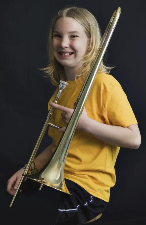 3 (1) beginner trombone player beginner with a trombone