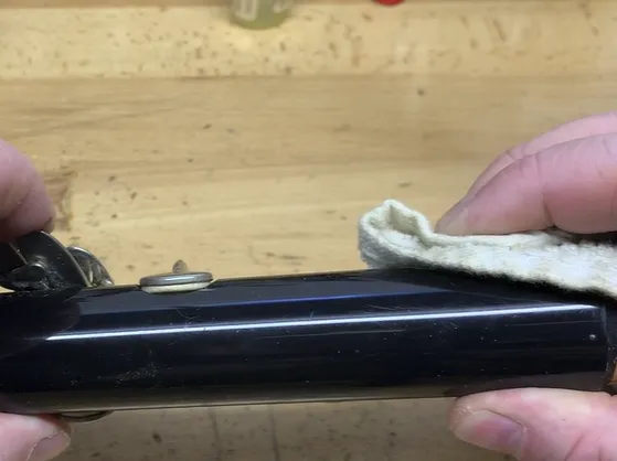Screenshot 2024-09-03 134346 Applying pressure to secure a replaced clarinet pad in place clarinet pad replacement